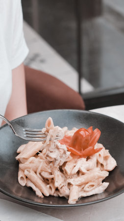 Tasty appetizing classic Italian pasta with a delicious sauce.の写真素材