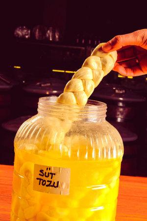Homemade fresh croissants in a jar on a wooden table