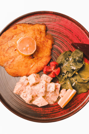 Delicious schnitzel served with french friesの写真素材