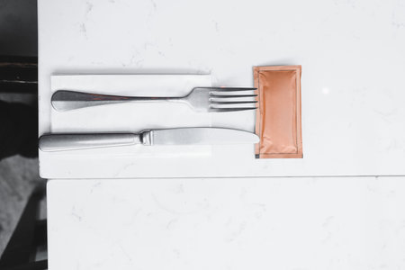 knife and fork on table decoration in restaurant interior - Vintage Light Filter