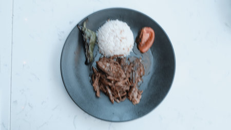 A sizzling hot plate of perfectly cooked meatの写真素材