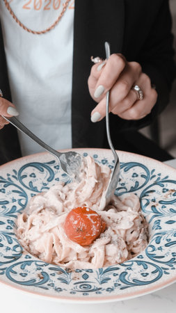 Tasty appetizing classic Italian pasta with a delicious sauce.の写真素材