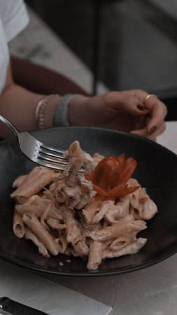 Tasty appetizing classic Italian pasta with a delicious sauce.の写真素材