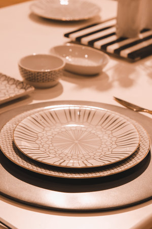 Ceramic tableware on the table, closeup of photo