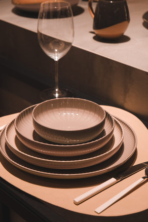 Set of porcelain plates and glasses on the table in restaurant
