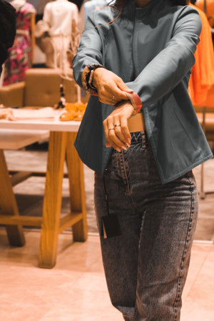 Close up of a fashion designer working in a clothing store.の写真素材