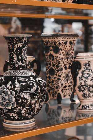 Antique ceramic vase on shelf in shop, Thailand. Vintage filter.の写真素材