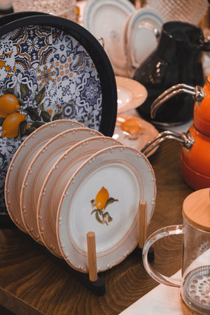 Ceramic plates and crockery on the table in the kitchenの写真素材
