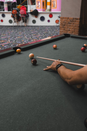 young pro billiard player finding best solution and right angle at billiard pool sport club