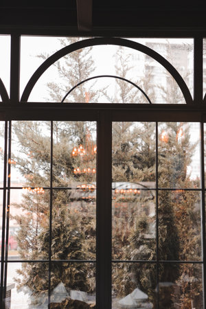 interior of a cafe with a beautiful view through the window.の写真素材