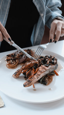 A sizzling hot plate of perfectly cooked meatの写真素材