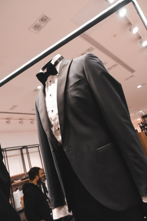 Tuxedo and bow tie on mannequin in fashion storeの写真素材