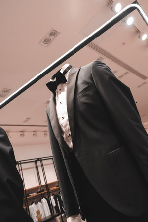 Wedding suit and bow tie on mannequin in shopの写真素材