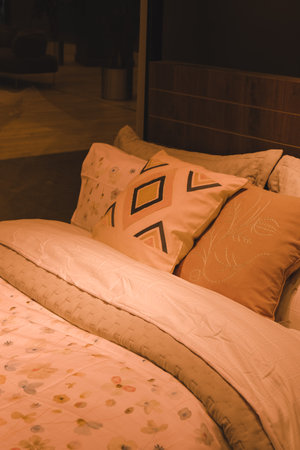 Beautiful pillow on bed decoration in bedroom interior - Vintage Light Filterの写真素材