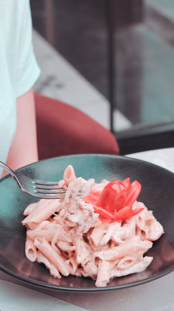 Tasty appetizing classic Italian pasta with a delicious sauce.の写真素材