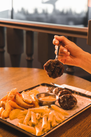 Delicious meatballs with french friesの写真素材