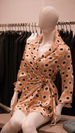 Women's clothes on a mannequin in a fashion store.の写真素材