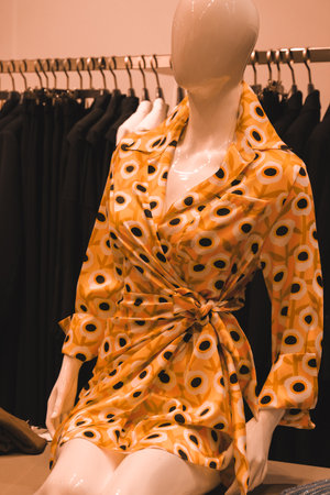 Women's dress on a mannequin in a fashion store.の写真素材