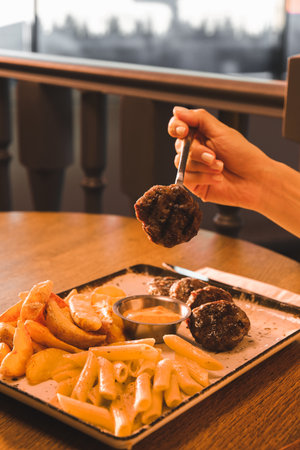 Delicious meatballs with french friesの写真素材