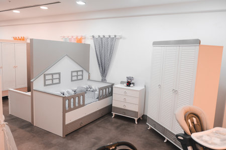 Interior of a children's room with a crib, a bedside table and a cotの写真素材
