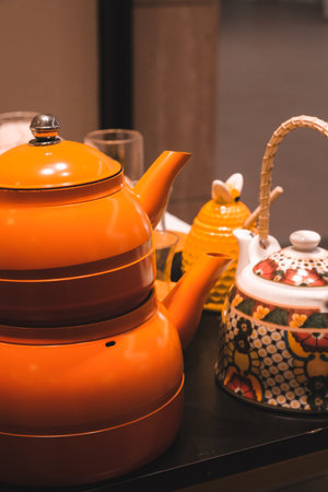 teapot and tea cup on shelf in coffee shopの写真素材