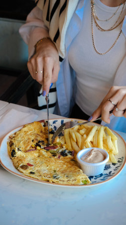 Delicious omelette and breakfast plate on the table.の写真素材
