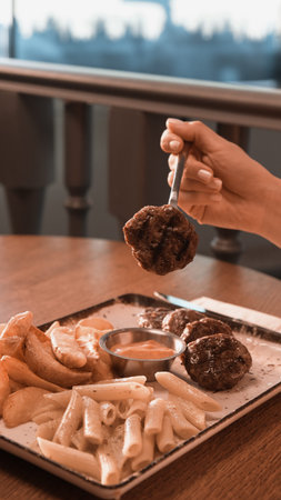 Delicious meatballs with french fries