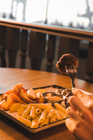 Delicious meatballs with french friesの写真素材