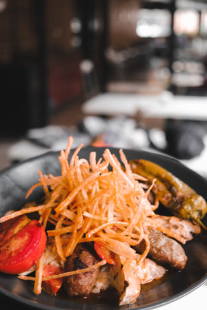 A sizzling hot plate of perfectly cooked meatの写真素材