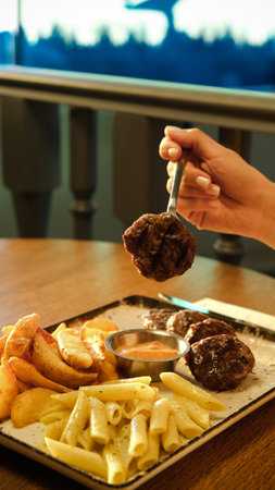 Delicious meatballs with french fries