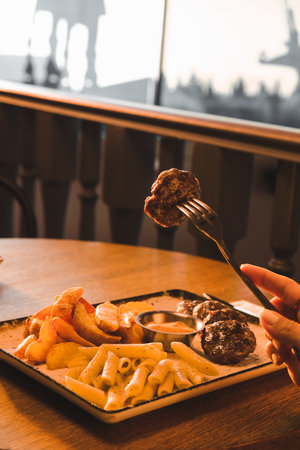 Delicious meatballs with french friesの写真素材