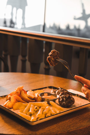 Delicious meatballs with french fries