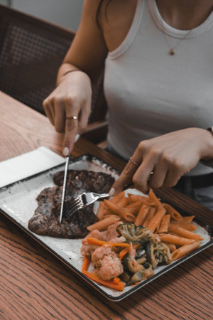 A sizzling hot plate of perfectly cooked meatの写真素材