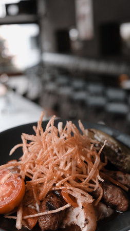 Savory and satisfying, a plate of grilled meatの写真素材