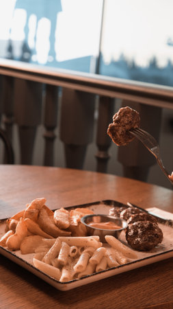 Delicious meatballs with french friesの写真素材