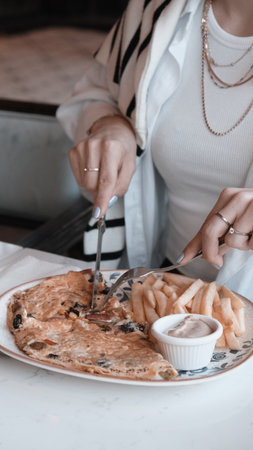 Delicious omelette and breakfast plate on the table.の写真素材