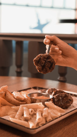 Delicious meatballs with french fries