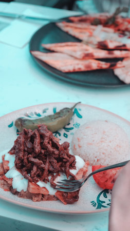 A sizzling hot plate of perfectly cooked meatの写真素材