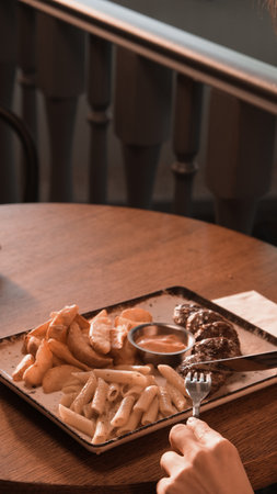 Delicious meatballs with french friesの写真素材