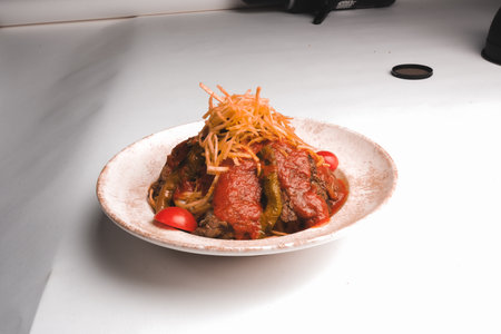 A sizzling hot plate of perfectly cooked meatの写真素材