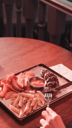 Delicious meatballs with french friesの写真素材