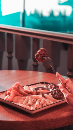 Delicious meatballs with french friesの写真素材