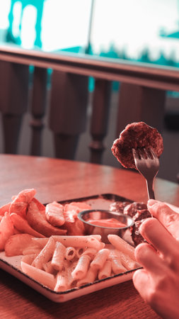 Delicious meatballs with french friesの写真素材