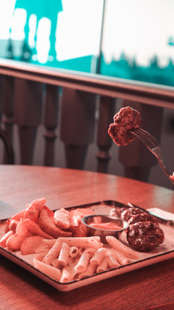 Delicious meatballs with french friesの写真素材