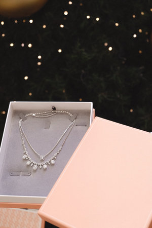 jewelry in a box on the background of the Christmas tree