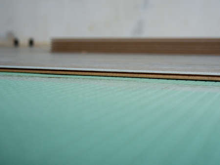 Laying laminate flooring. Laminate and substrate green.の写真素材