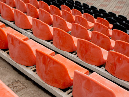 Empty seats in a sports stadium. Lack of spectators at the stadium during the pandemic.