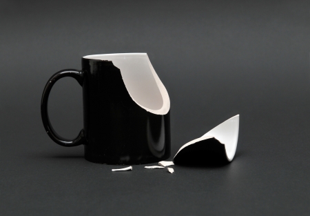 Broken Cup on black Backgroundの写真素材