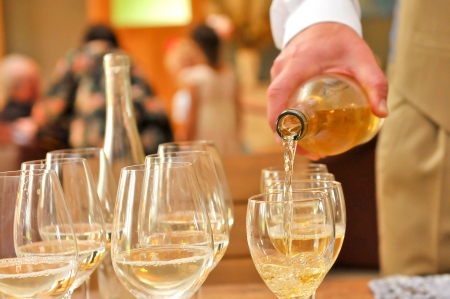 Pouring champagne into a glassesの写真素材