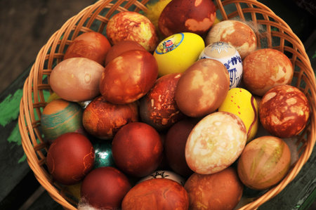 Traditionally painted easter eggs in the basket